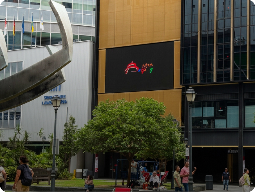 LED screen on a commercial office building façade above a public plaza