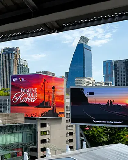 Imagine Your Korea billboards above a shopping centre in Bangkok, Thailand