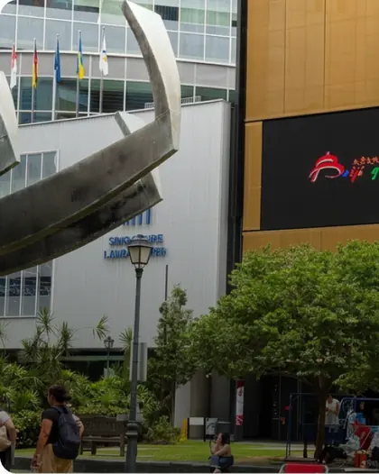 LED screen on a commercial building façade above a landscaped public plaza