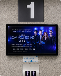 Lift lobby screen advertising the Now You See Me live show
