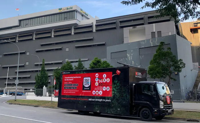 DBS SME Banking mobile advertising truck with an LED display screen parked by the roadside in Singapore