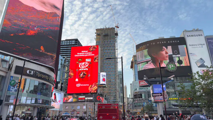 Korea Tourism ads on LED billboards at a busy downtown intersection in Toronto, Canada