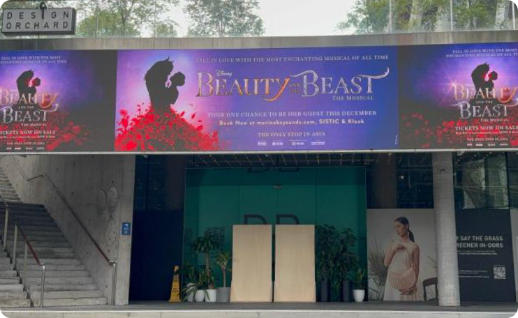 Digital billboard advertising above the entrance of Design Orchard, Singapore